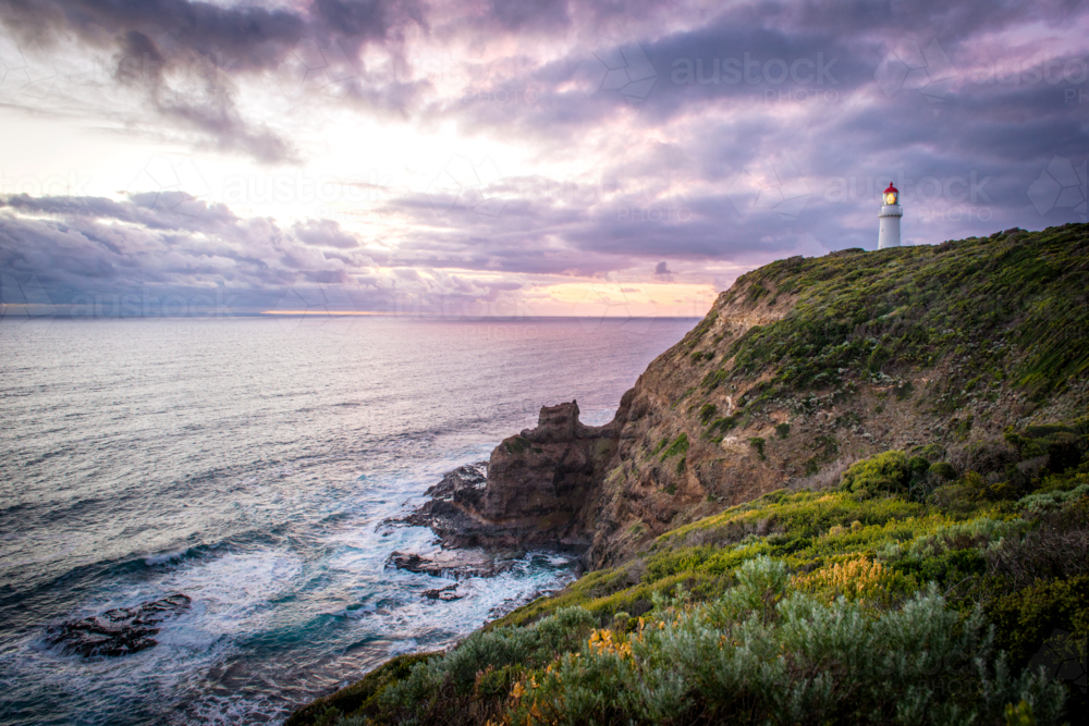 Cape Schanck lighthouse at sunset with dramatic coastal cliffs - Australian Stock Image