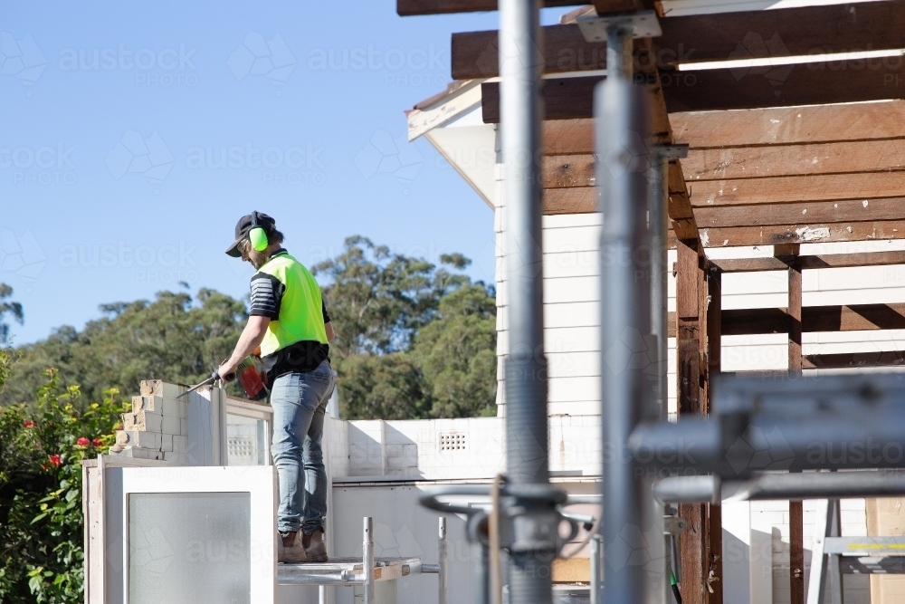 Capenter trade working on a home renovation construction site - Australian Stock Image