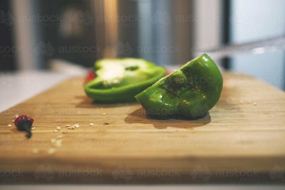 Capsicum on cutting board - Australian Stock Image