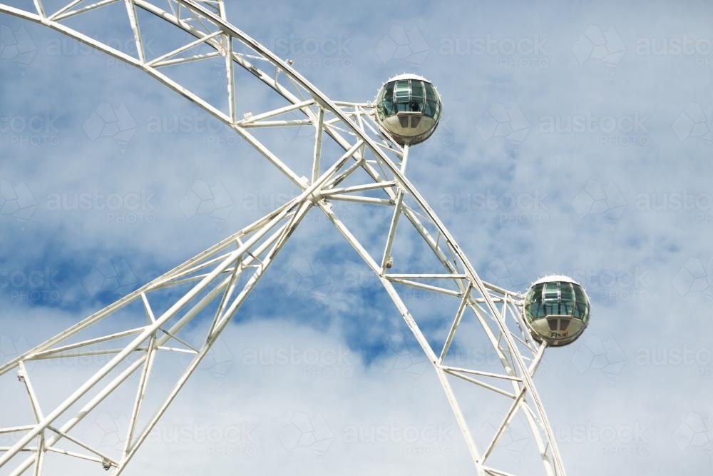 Capsules on a large ferris wheel, high in the sky - Australian Stock Image