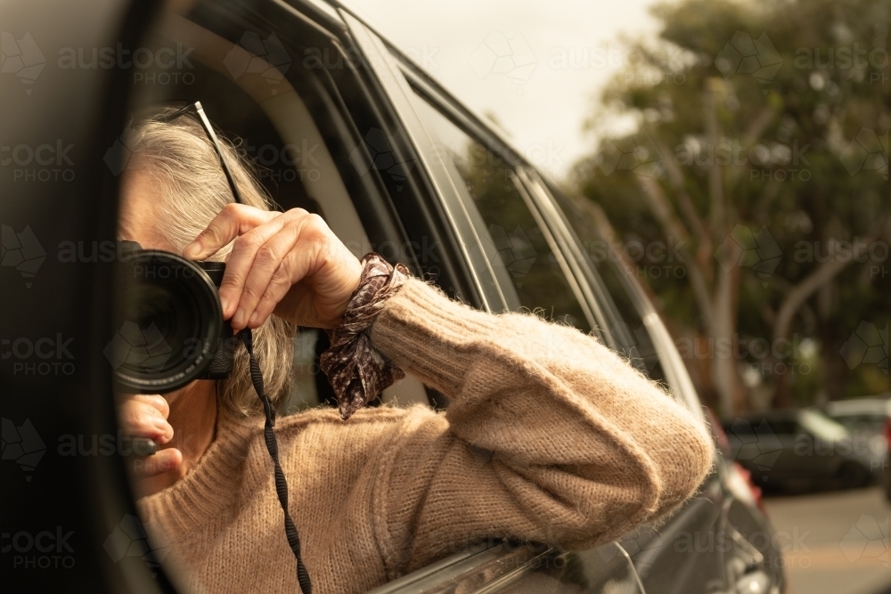 Capturing the Photographer in car mirror with camera - Australian Stock Image