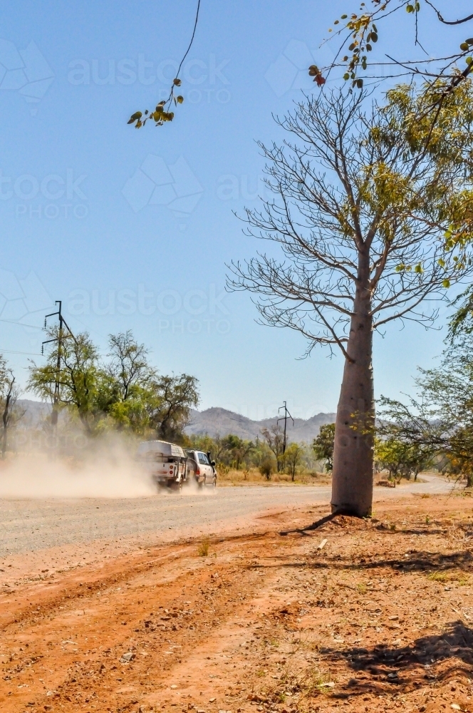 Car and Camper on a dirt road - Australian Stock Image