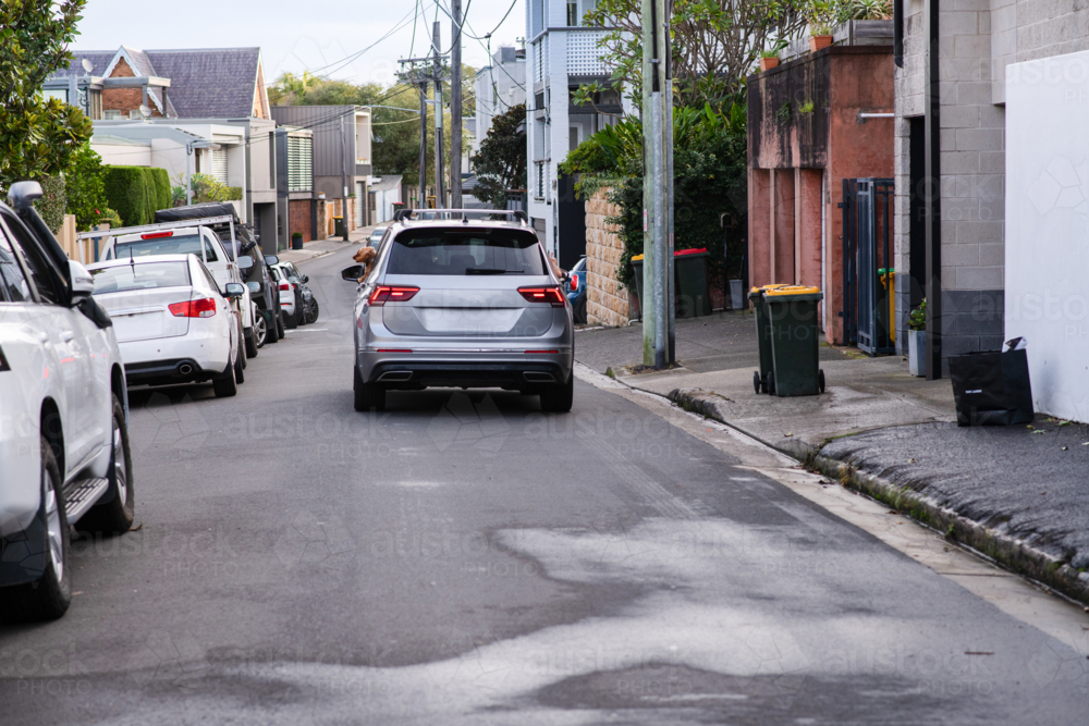car driving down a narrow street in Sydney - Australian Stock Image