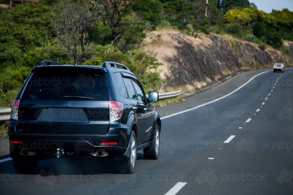 Image of Car driving on highway Austockphoto