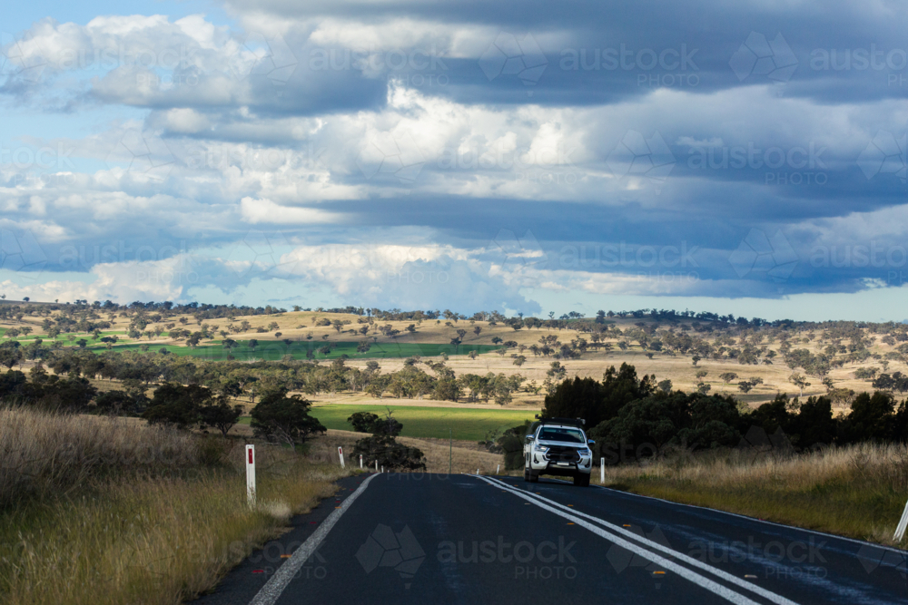 Image of Car driving on highway road in rural Australia - Austockphoto