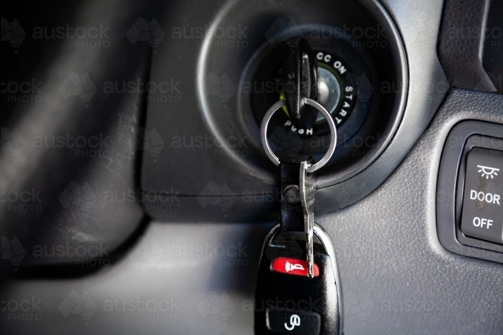 Image of Car keys in ignition of car - Austockphoto