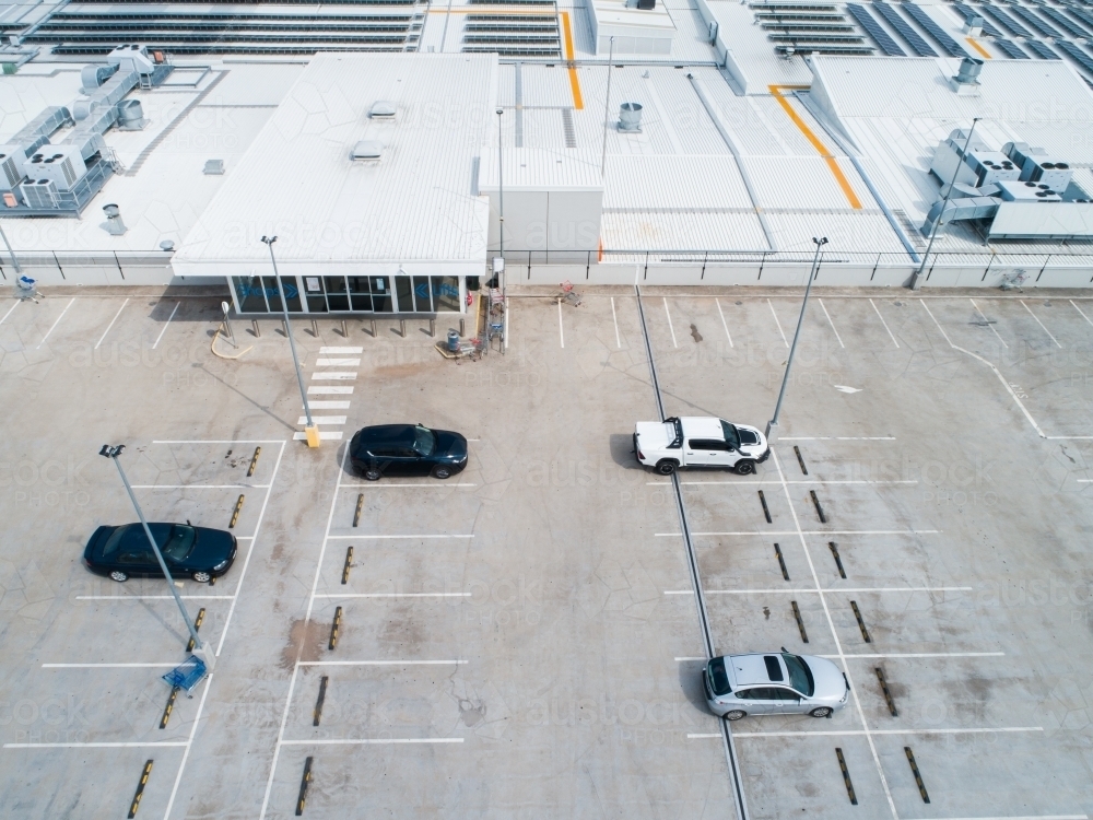 Car park beside shopping center in town - Australian Stock Image