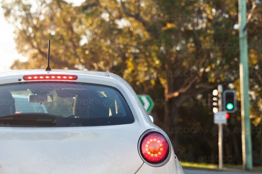 car turning at traffic lights interscetion - Australian Stock Image