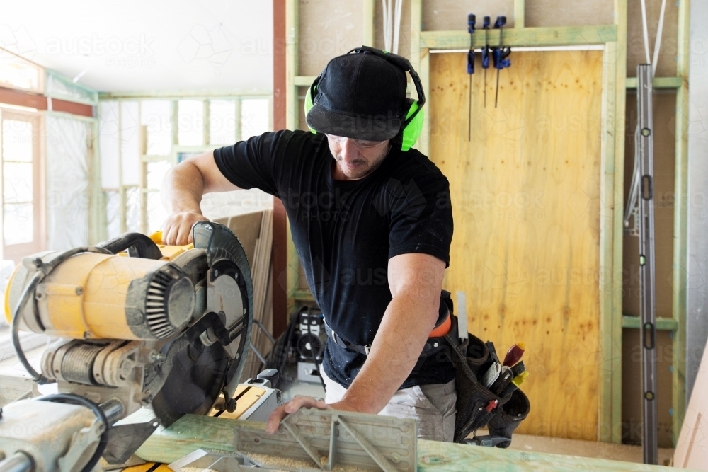 Carpenter at work on home construction site - Australian Stock Image