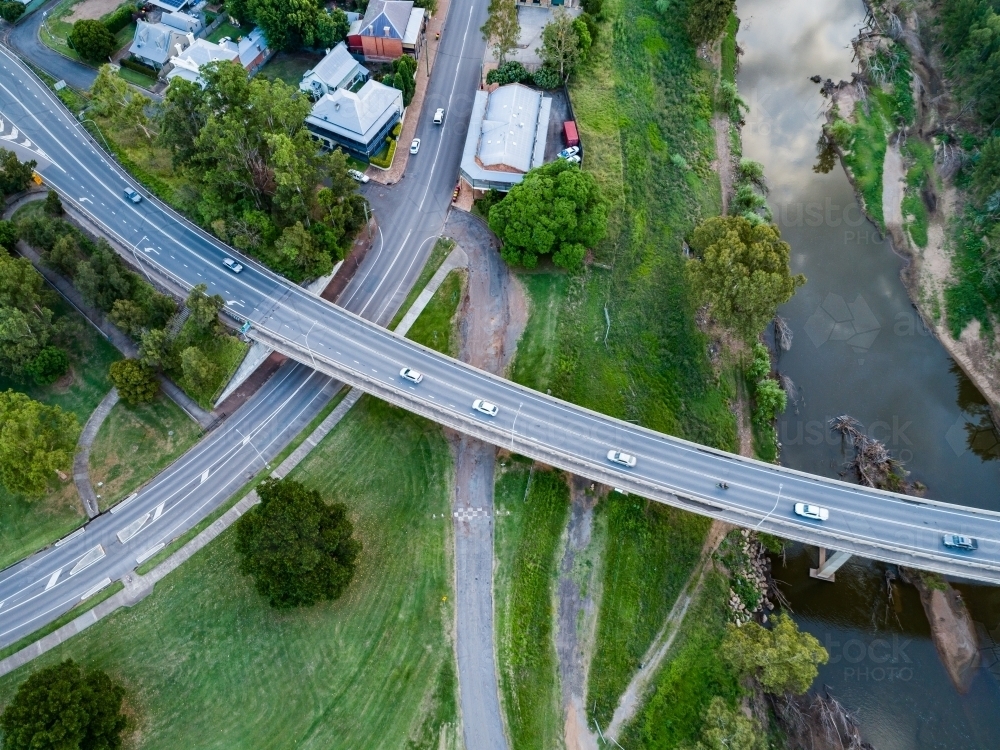 Cars crossing bridge over Hunter River into town - Australian Stock Image