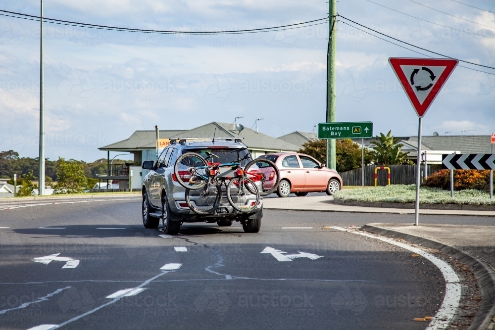 Cars driving around a roundabout - Australian Stock Image