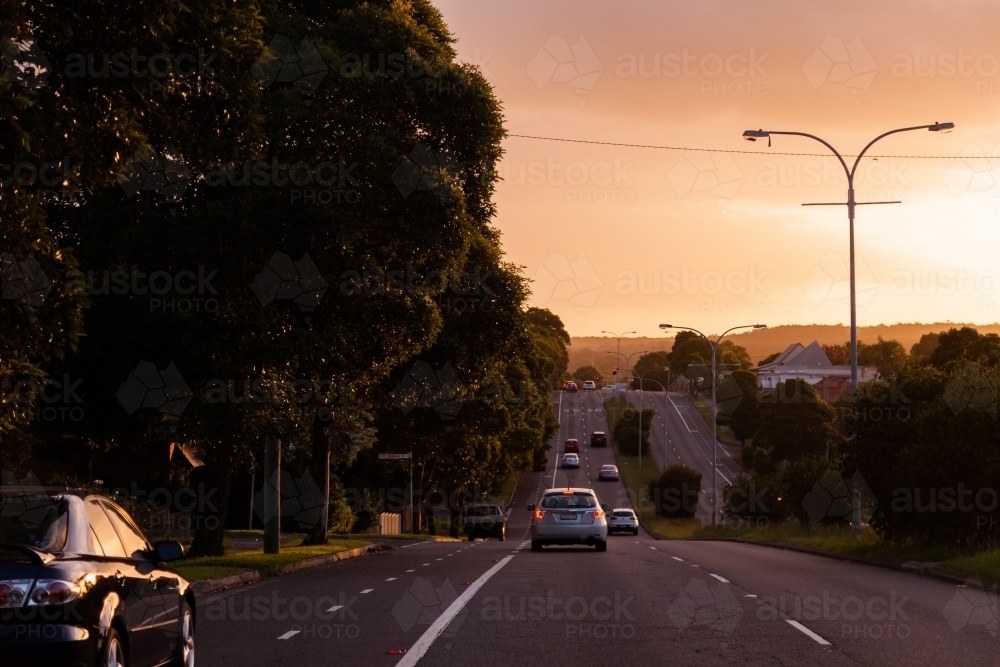 Cars driving in low light conditions with hazardous visibility - Australian Stock Image