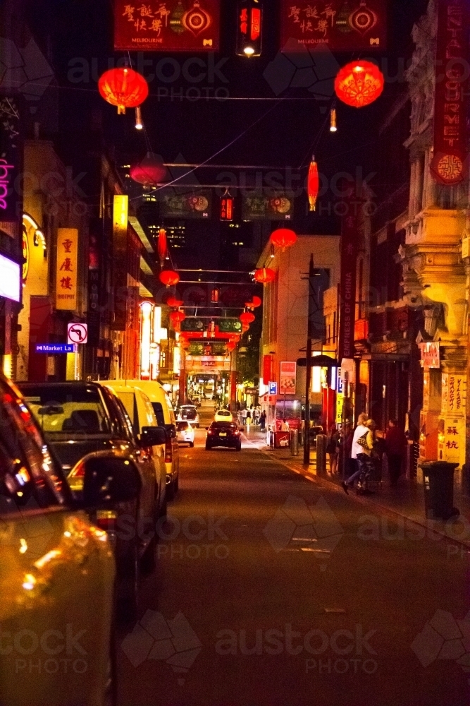 Cars parked on street in Chinatown at night - Australian Stock Image