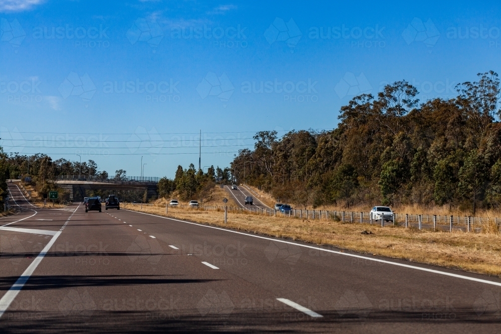 Image of Cars travelling on divided highway with on ramp and off ramp ...