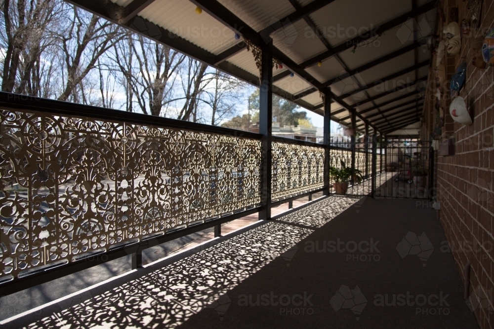 Cast iron railing on a hotel balcony - Australian Stock Image