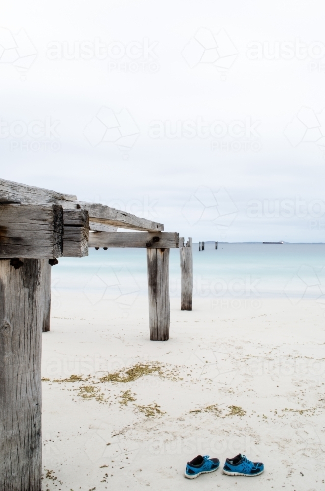 Castletown Jetty ruins on the beach and forgotten shoes - Australian Stock Image