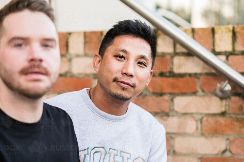 casual portrait of gay man with his partner - Australian Stock Image