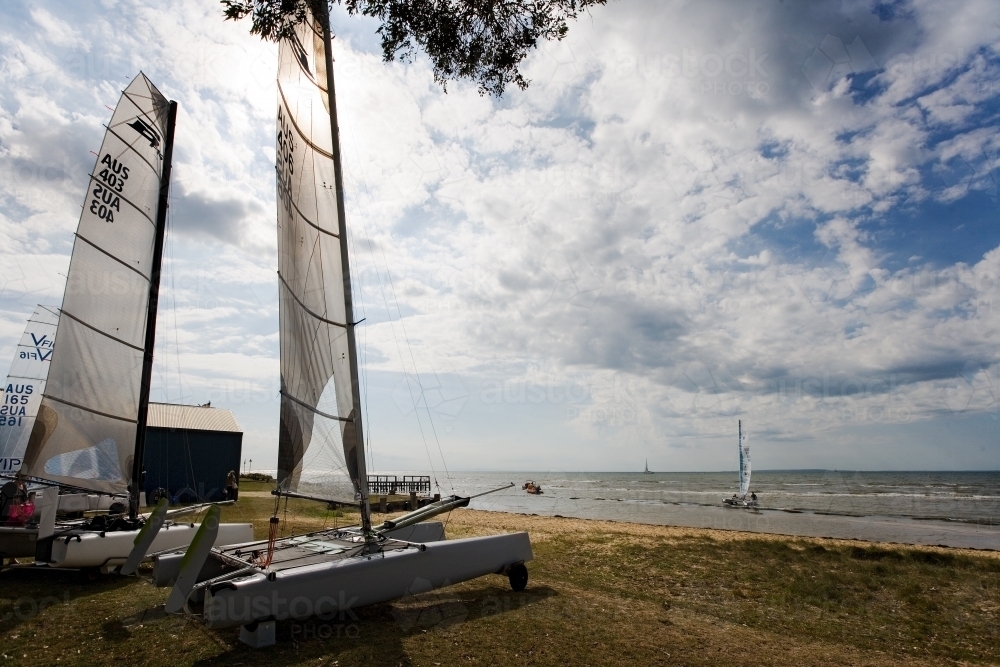 Catamaran and yacht at regional yacht club - Australian Stock Image
