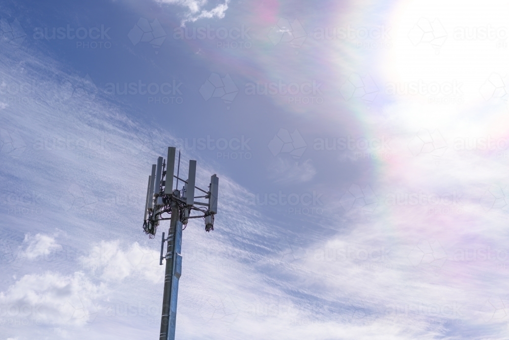Cell phone telecommunication tower on blue sky and amazing clouds background, Melbourne - Australian Stock Image