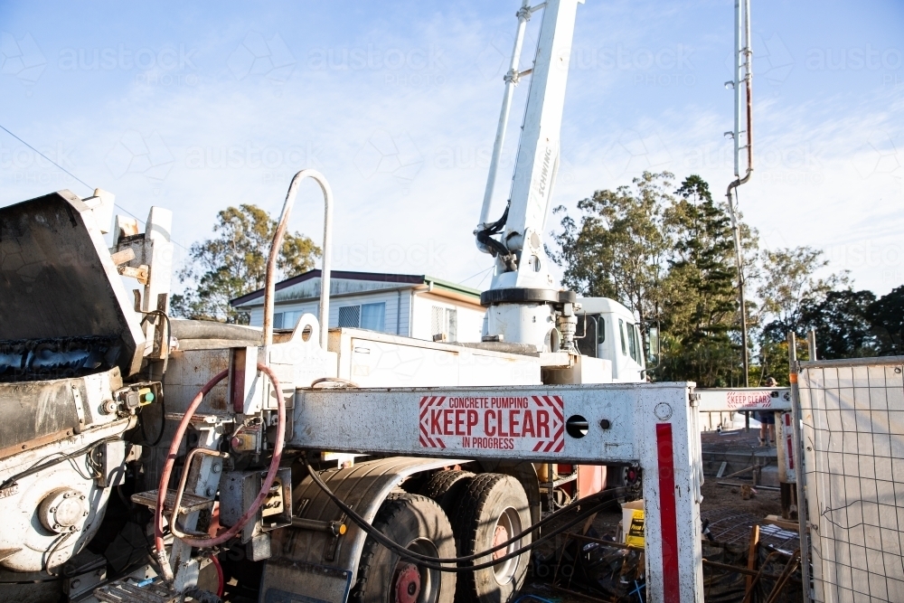 Image of cement pump truck at work Austockphoto