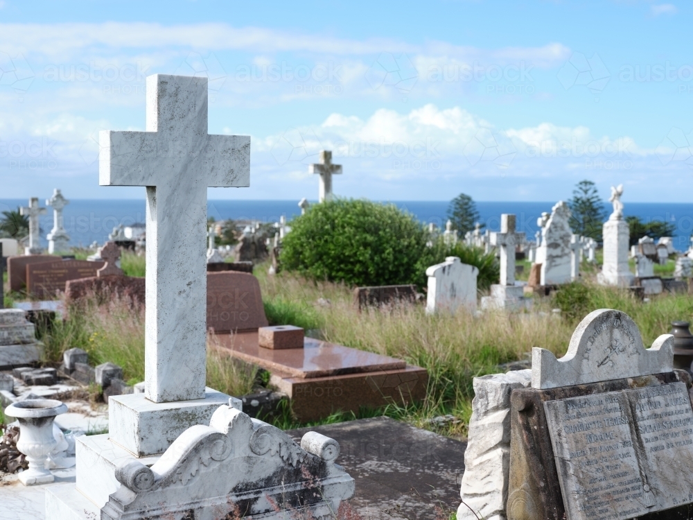Cemetery with cross sculptures and grave stones - Australian Stock Image
