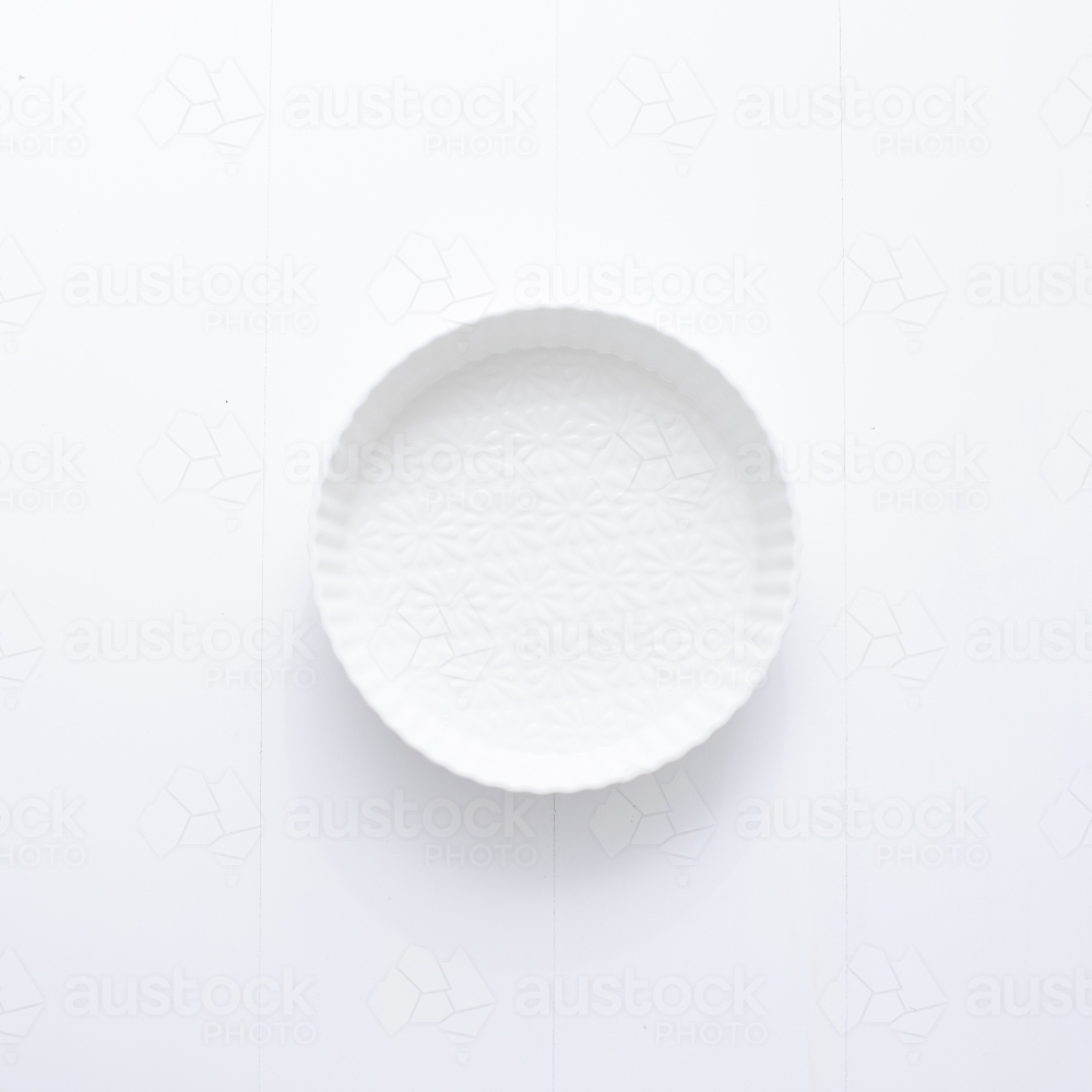 Ceramic pie dish on blank background - Australian Stock Image