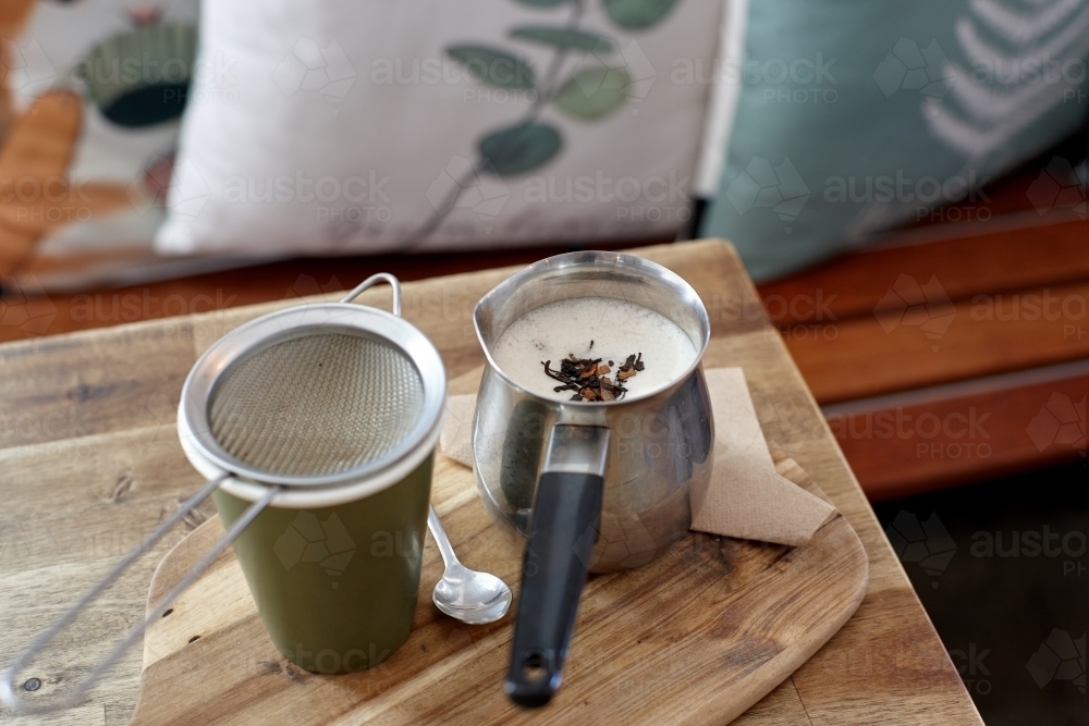 Chai latte prepared on table in cafe - Australian Stock Image