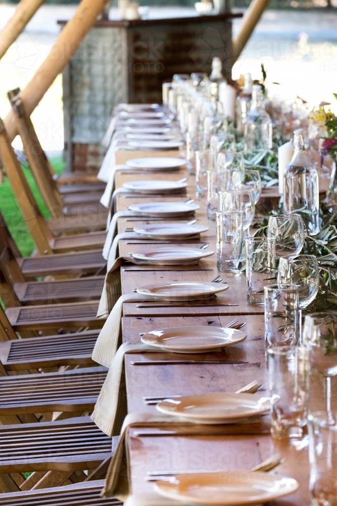 Chairs and table setting ready for guests - Australian Stock Image