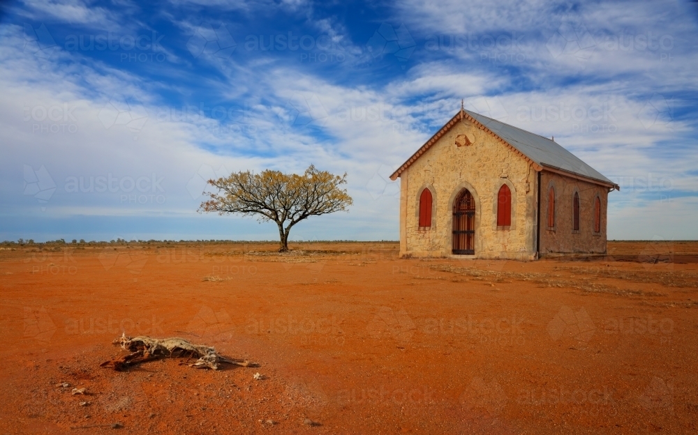 Chapel in harsh desolate foreboding landscape of inland Australia - Australian Stock Image