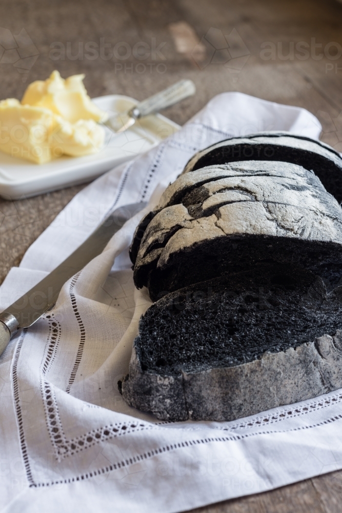 Image of charcoal bread with butter Austockphoto