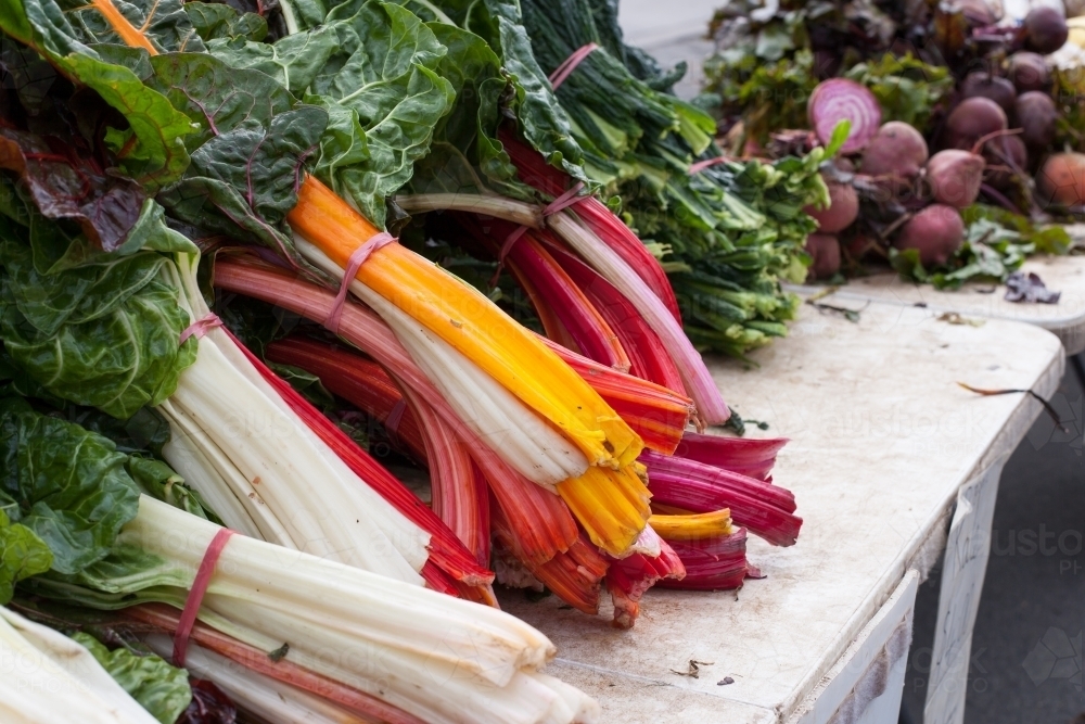 Chards and radishes at a regional farmers market - Australian Stock Image