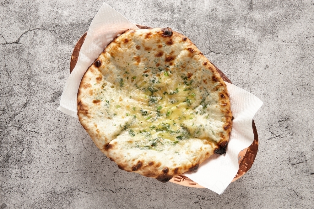 Cheese and garlic naan bread - Australian Stock Image