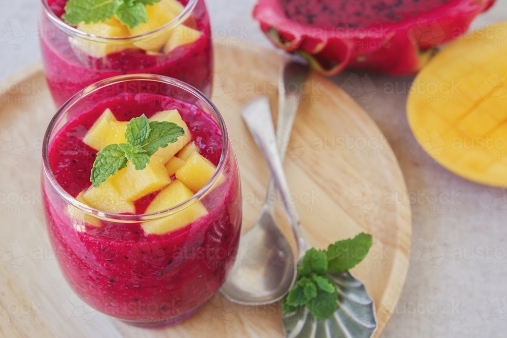 Chia seeds pudding with red dragon fruit and mango - Australian Stock Image