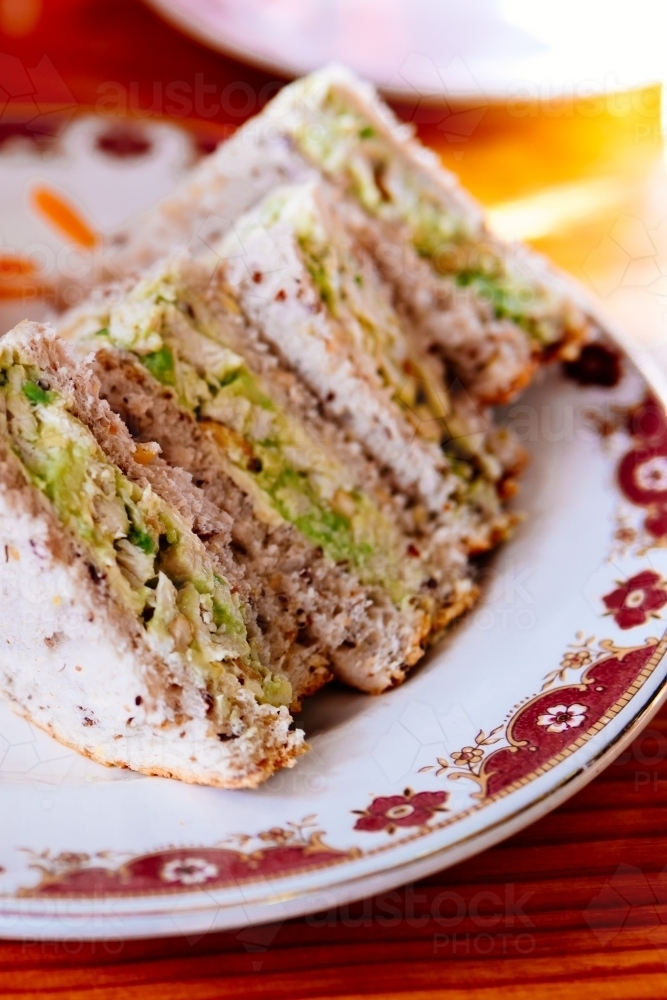 Chicken avocado sandwich on a plate. - Australian Stock Image