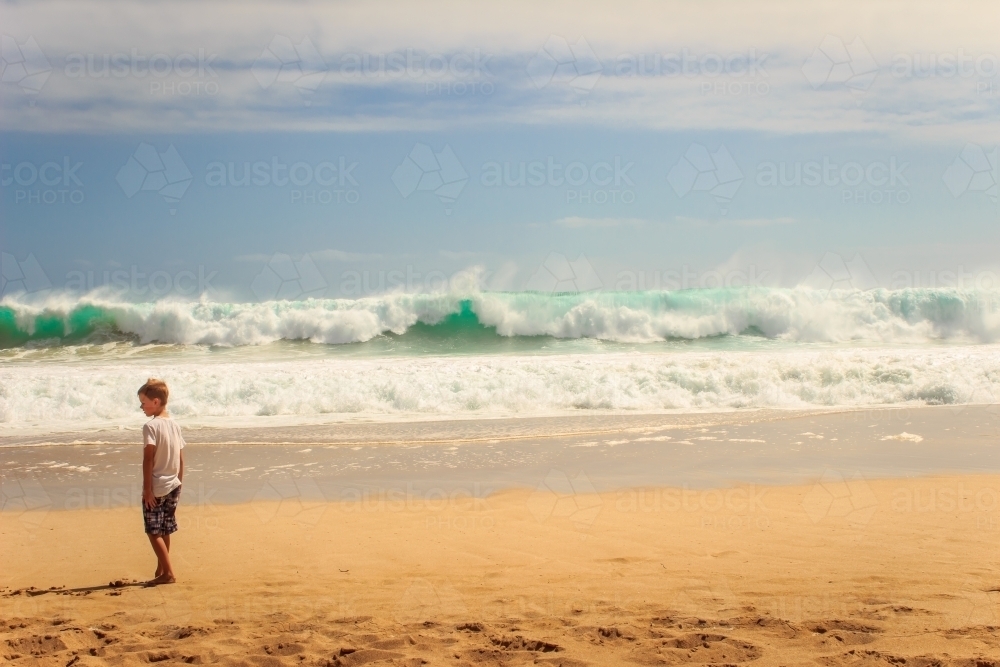 Child and waves at the beach, Yorke Peninsula, South Australia - Australian Stock Image