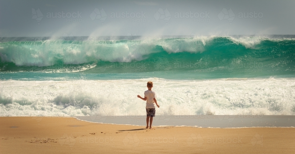 Child and waves at the beach, Yorke Peninsula, South Australia - Australian Stock Image