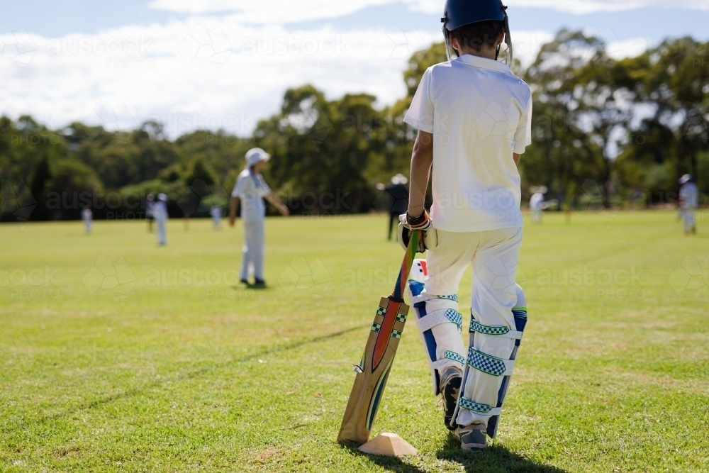 Child at cricket waiting to bat - Australian Stock Image