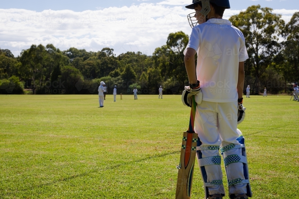 Child at cricket waiting to bat - Australian Stock Image