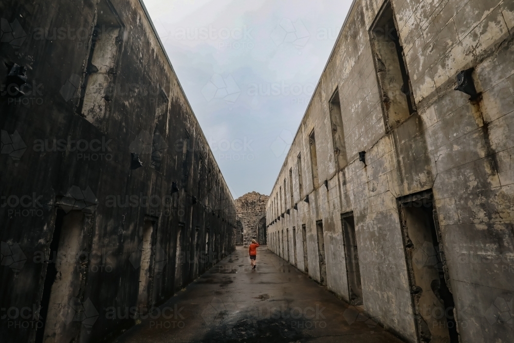 Child exploring the ruins of Trial Bay Gaol at Arakoon NSW Australia - Australian Stock Image