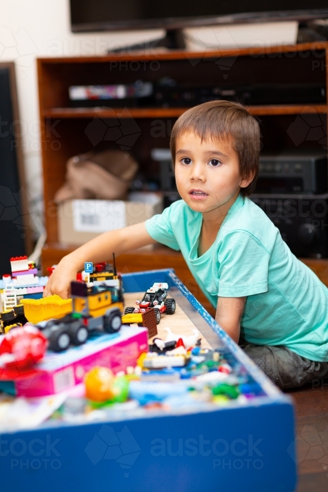 Child playing with toys at home - Australian Stock Image