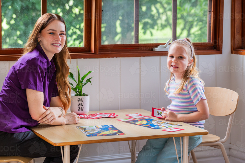 Image of Child with speech disability looking at sound cards talking ...