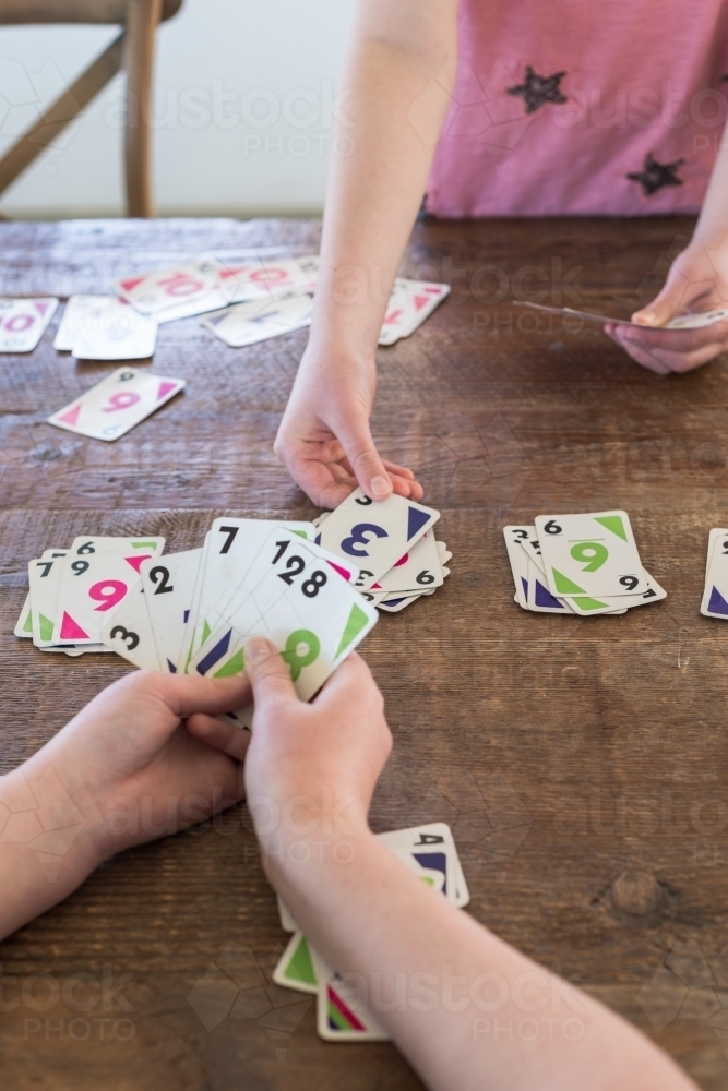 children playing cards - Australian Stock Image