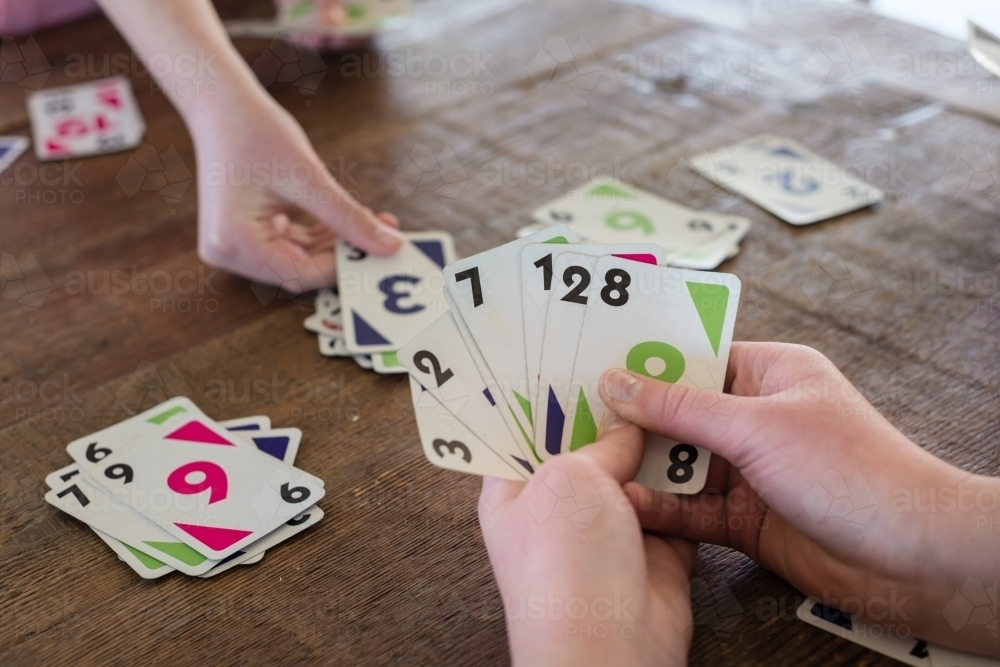 children playing cards - Australian Stock Image
