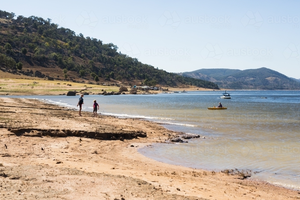 Children playing in the water at Wyangala dam - Australian Stock Image