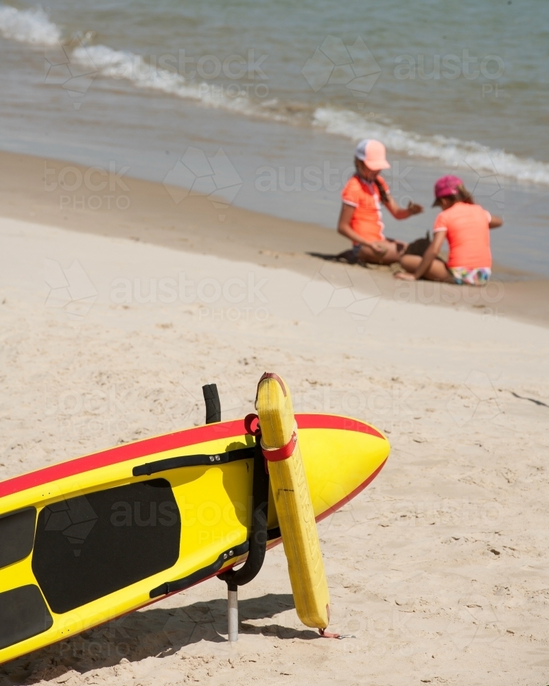 Children playing in water with surf ski in foreground - Australian Stock Image