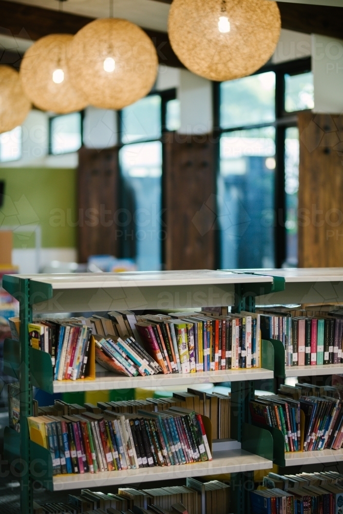 Children's books on a library shelf - Australian Stock Image