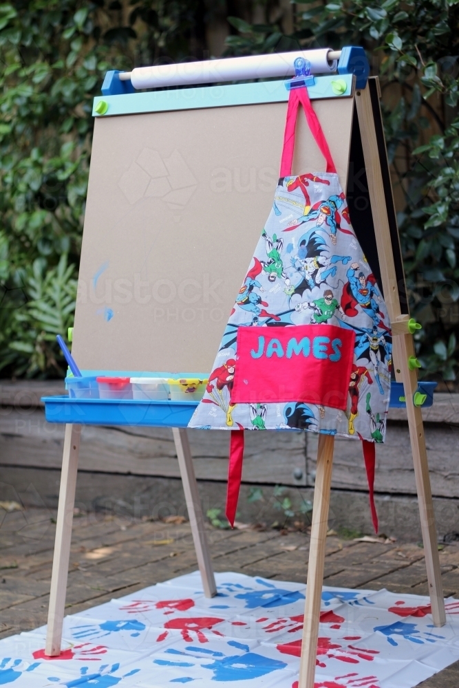 Childrens paint easel with apron - Australian Stock Image