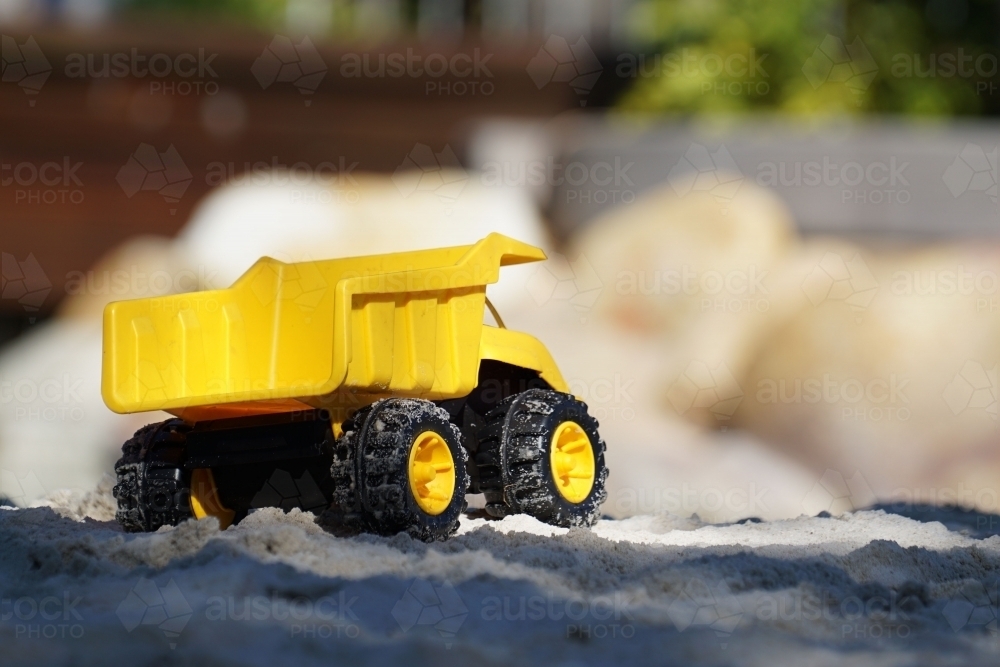 Childs toy truck in sandpit - Australian Stock Image