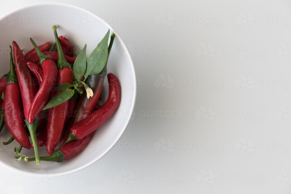 Chillies In A White Bowl - Close Left - Australian Stock Image