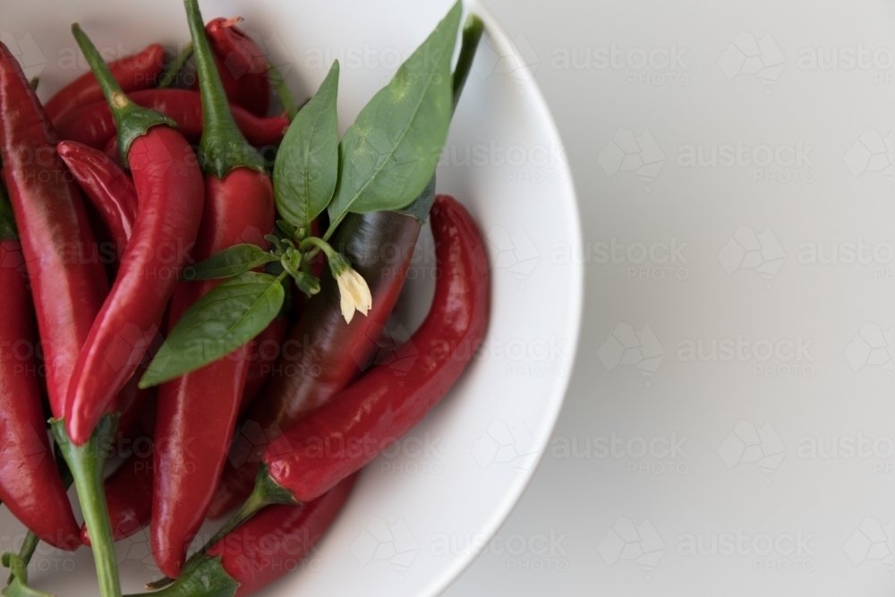 Chillies In A White Bowl - Close Up - Australian Stock Image